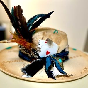 Custom made ladies hats, embellished with feathers, charms, material & leather